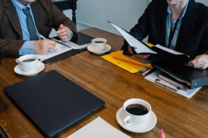 a group of people sitting at a table success