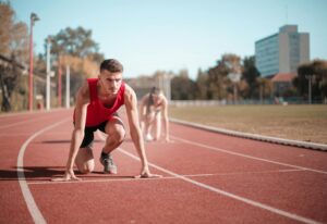 Strong sportsmen ready for running on stadium